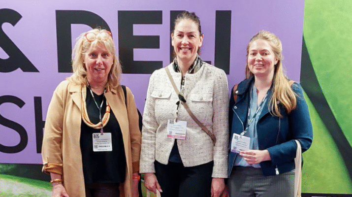 Original Biscuit Bakers colleagues at the Farm Shop & Deli Show, standing in front of exhibition signage.