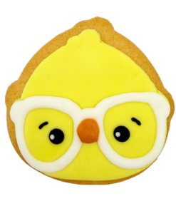 Original Biscuit Bakers Chloe Clever Clucks Easter sugar cookie chick biscuit with yellow icing and white glasses.